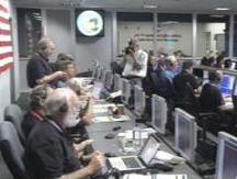UMD's Michael A'Hearn (bottom left) and other EPOXI team members in JPL mission control after closest flyby.