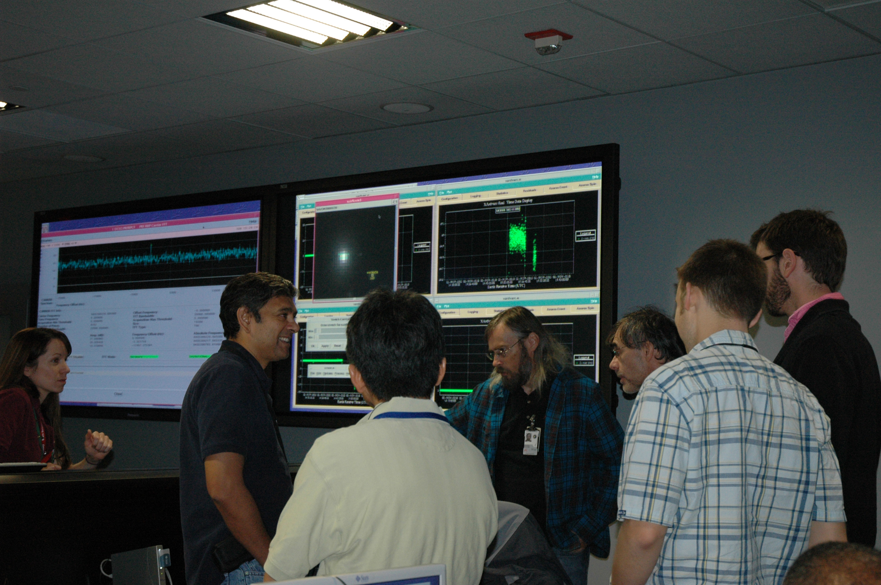 EPOXI navigation team members and engineers in mission control.