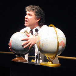 Dr. Jeff Goldstein with a globe.