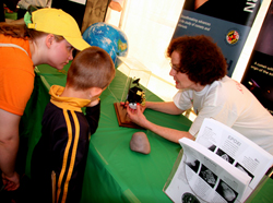 Lucy McFadden showing the DI spacecraft and model of Tempel 1