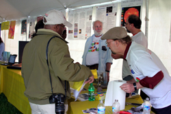 Dr. Dennis Wellnitz helps a parent with questions from the Science Hunt.