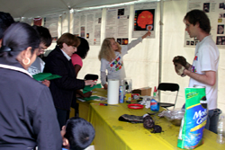 Dr. Ludmilla Kolokolova answers questions about EPOXI while Dr. Mike Kelley builds a dirty snowball comet.