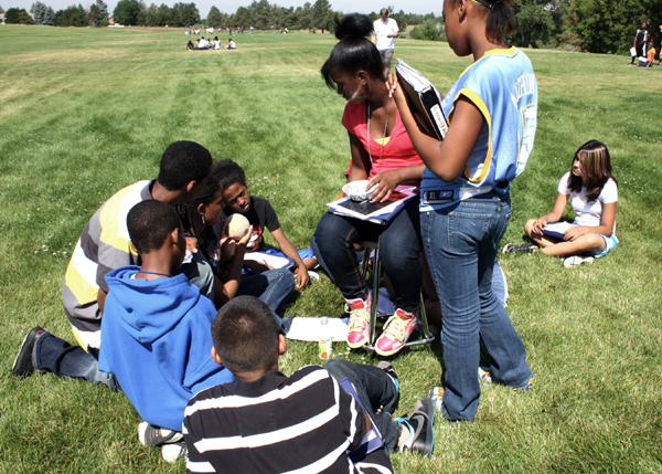 Kailah, third from left, orients her students to the inner solar system and short period comets.